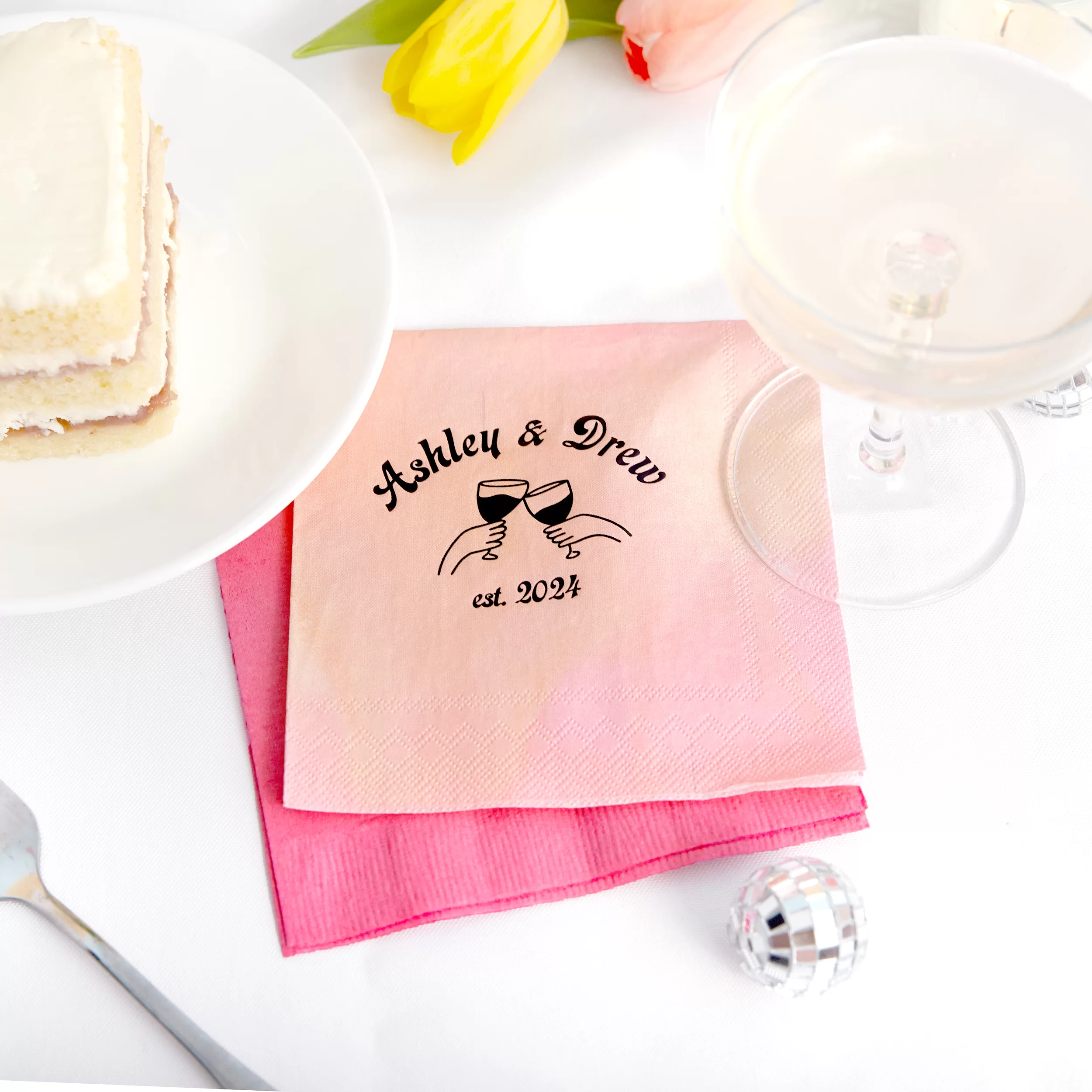 pink napkin with hand-drawn image of glasses clinking