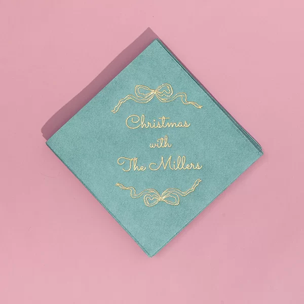 Holiday Bows Napkin on pink background