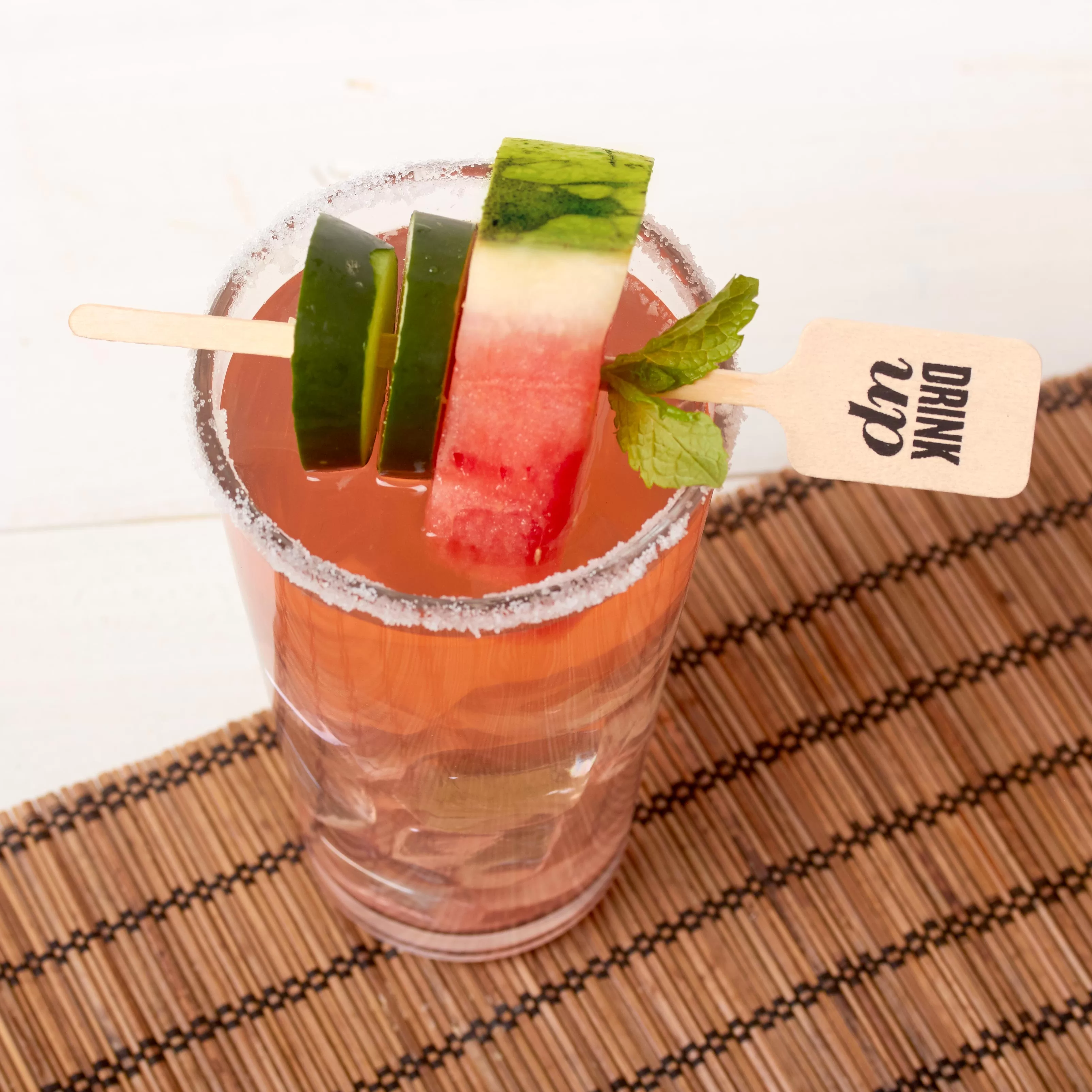 watermelon and cucumber cocktail with a custom drink stirrer