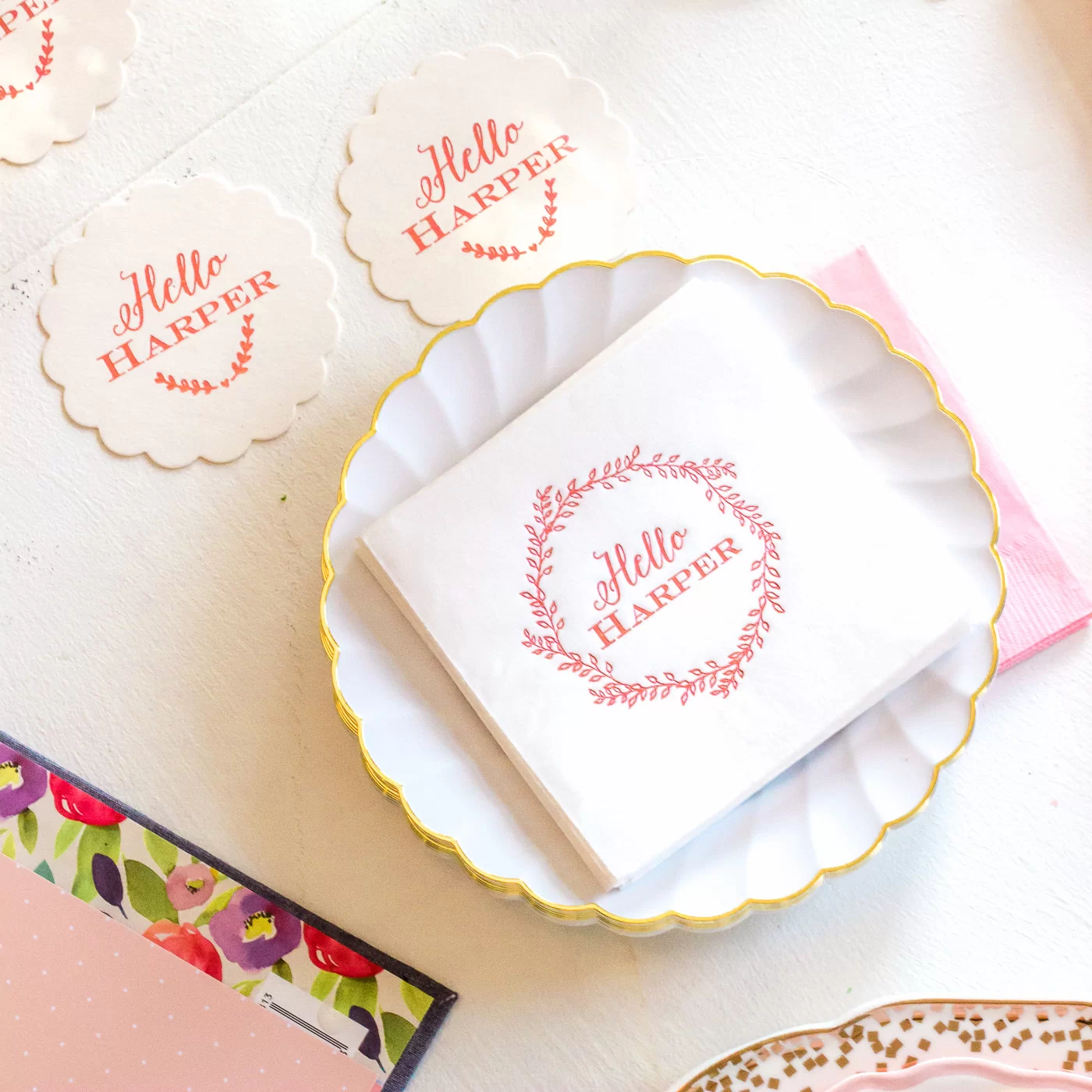 foil stamped pink baby napkins with a leaf wreath for a baby girl sip and see