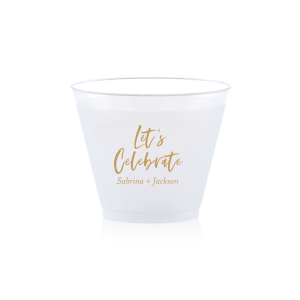 Toast to joyous occasions with the Festive Let's Celebrate Frosted Cup. Emblazoned with "Let’s Celebrate" in an exuberant script font, it embodies the spirit of festivity. Beneath, the couple’s first names invite guests to partake in the joy, making it both a welcoming gesture and a celebration of the couple.