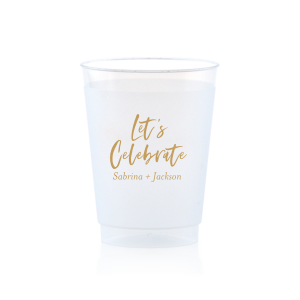 Toast to joyous occasions with the Festive Let's Celebrate Frosted Cup. Emblazoned with "Let’s Celebrate" in an exuberant script font, it embodies the spirit of festivity. Beneath, the couple’s first names invite guests to partake in the joy, making it both a welcoming gesture and a celebration of the couple.