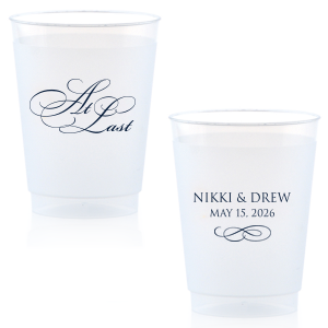The At Last Cup features elegant calligraphy reading “At Last” reversed with the couple's names and a graceful flourish for a timeless drinkware detail. Use it to elevate your celebration with a romantic touch. Refined for wedding receptions and sentimental keepsakes.