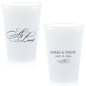 The At Last Cup features elegant calligraphy reading “At Last” reversed with the couple's names and a graceful flourish for a timeless drinkware detail. Use it to elevate your celebration with a romantic touch. Refined for wedding receptions and sentimental keepsakes.
