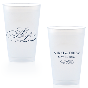 The At Last Cup features elegant calligraphy reading “At Last” reversed with the couple's names and a graceful flourish for a timeless drinkware detail. Use it to elevate your celebration with a romantic touch. Refined for wedding receptions and sentimental keepsakes.