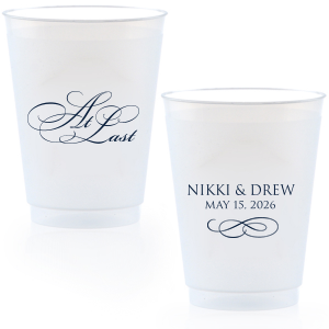 The At Last Cup features elegant calligraphy reading “At Last” reversed with the couple's names and a graceful flourish for a timeless drinkware detail. Use it to elevate your celebration with a romantic touch. Refined for wedding receptions and sentimental keepsakes.