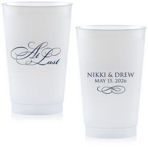 The At Last Cup features elegant calligraphy reading “At Last” reversed with the couple's names and a graceful flourish for a timeless drinkware detail. Use it to elevate your celebration with a romantic touch. Refined for wedding receptions and sentimental keepsakes.
