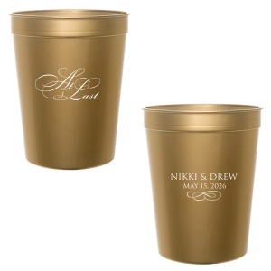 The At Last Couples Cup features elegant calligraphy reading “At Last” reversed with the couple's names and a graceful flourish for a timeless drinkware detail. Use it to elevate your celebration with a romantic touch. Refined for wedding receptions and sentimental keepsakes.