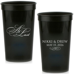 The At Last Couples Cup features elegant calligraphy reading “At Last” reversed with the couple's names and a graceful flourish for a timeless drinkware detail. Use it to elevate your celebration with a romantic touch. Refined for wedding receptions and sentimental keepsakes.