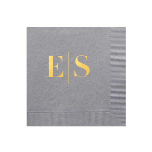 The Modern Serif Initials Napkin features bold serif initials separated by a clean vertical line for a modern, tailored look. Add it to elevate place settings with understated sophistication. Refined for weddings and cocktail hours.