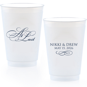 The At Last Cup features elegant calligraphy reading “At Last” reversed with the couple's names and a graceful flourish for a timeless drinkware detail. Use it to elevate your celebration with a romantic touch. Refined for wedding receptions and sentimental keepsakes.