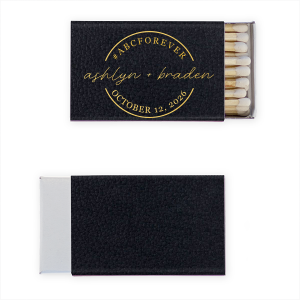 The Eternal Union Matchbox is a chic emblem of unity. Atop, a bold arc features a unifying hashtag blending initials and ‘Forever’, capturing love’s permanence. Centered in the badge, a flowy, lowercase script names the couple, while the arc below seals the design with the event date. This matchbox symbolizes a timeless journey, embracing modern traditions with a hashtag’s playful twist.
