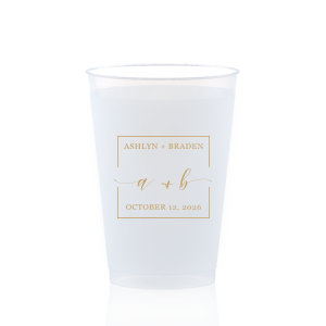 The Square Monogram Frame Cup features elegant script of the couple’s initials, paired with their names and special date within a clean rectangular border for a refined drinkware detail. Use it to elevate beverage service with a polished, personalized touch. Refined for wedding receptions or rehearsal dinners.