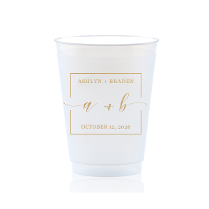 The Square Monogram Frame Cup features elegant script of the couple’s initials, paired with their names and special date within a clean rectangular border for a refined drinkware detail. Use it to elevate beverage service with a polished, personalized touch. Refined for wedding receptions or rehearsal dinners.