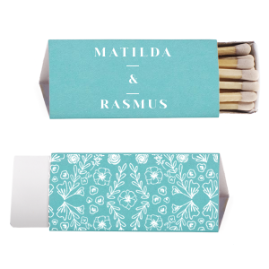 The Cottagecore Floral Matches blend rustic charm with personal sentiment. The couple's first names are showcased, connected by a framed ampersand, symbolizing unity. The reverse side reveals a lush garden motif, rich with flowers, greens, and hidden hearts, evoking a serene, nature-inspired ambiance. 