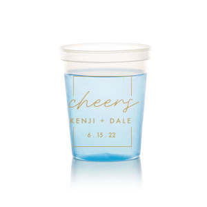 The Framed Cheers Cup design elegantly frames the word "cheers" in a handwritten-style script, creating a subtle yet sophisticated toast to the couple. Positioned below are their names and the event date, all encased within a tasteful artful border, adding a refined touch to this celebratory cup.