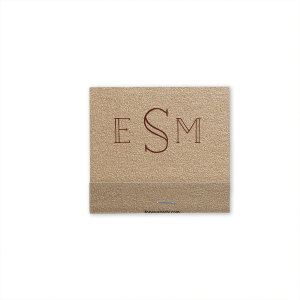 The Monogram Flower Matchbox design combines simplicity with elegance. On one side, a modern monogram in a refined font represents the couple. The other side features a single peony, symbolizing love, honor, and joy, amidst lush greenery. This matchbox is a subtle yet meaningful nod to lasting love and beauty.