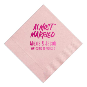 The Almost Married Napkin design exudes excitement and anticipation for an impending wedding. Featuring "ALMOST MARRIED" in bold, all caps for impact, it's perfect for destination weddings. Below, the couple's names and a welcoming note to the city add a personalized and inviting touch. Whether in welcome bags, at the rehearsal dinner or other prenuptial festivity, this Almost Married napkin customized with the bride and groom's names and destination is sure to be unforgettable.