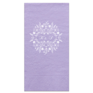 The Blossoming Floral Frame Napkin design features a regal wreath of roses, peonies, and lush greenery, symbolizing love's abundance. At its heart, the couple's initials intertwine in an elegant script, capturing the essence of unity and togetherness within this charming, botanical motif.