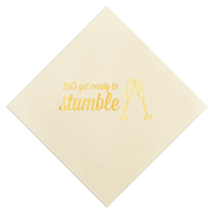 Raise a toast with the Toast & Stumble Napkin, a symbol of spirited celebration. It boldly declares “Let’s get ready to Stumble” alongside a graphic of clinking champagne flutes, perfectly capturing the essence of a lively, festive occasion filled with toasts, cheer, and unforgettable moments.