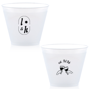 The Sunburst Initial & Toasting Glass Cup features an oval frame with classic initials, a subtle star accent, and a toast illustration with the date on the reverse. Order yours to serve drinks with a chic, custom feel guests will love. Fitting for weddings and engagement parties!