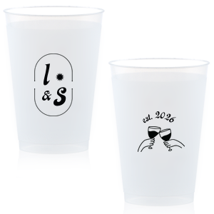The Sunburst Initial & Toasting Glass Cup features an oval frame with classic initials, a subtle star accent, and a toast illustration with the date on the reverse. Order yours to serve drinks with a chic, custom feel guests will love. Fitting for weddings and engagement parties!