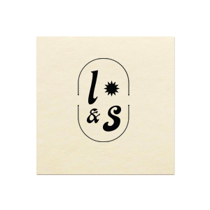 The Sunburst Initial Napkin features bold initials framed by a modern oval emblem with a sunburst accent. Add it to your powder room or dining table to create a polished, custom look guests will notice. Perfect for weddings, housewarmings, or elevated entertaining!