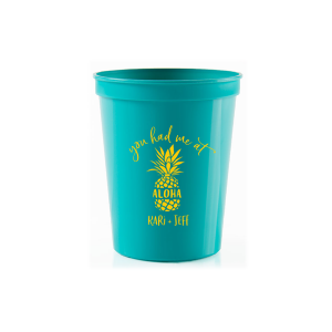 Sip the Tropical Romance. Raise a toast with the You had Me at Aloha Cup. Featuring a charming pineapple graphic with "Aloha" banded across it, this design gives a playful twist to a classic romantic movie line. Perfect for couples who want to add a touch of Hawaiian charm to their special day.

