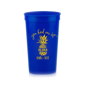 Sip the Tropical Romance. Raise a toast with the You had Me at Aloha Cup. Featuring a charming pineapple graphic with "Aloha" banded across it, this design gives a playful twist to a classic romantic movie line. Perfect for couples who want to add a touch of Hawaiian charm to their special day.

