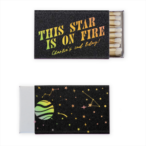 The Cosmic Space Party Match features bold slanted typography reading “This Star Is On Fire” paired with celestial planet illustrations and constellation details on the reverse. Grab it to spotlight a personality that deserves the cosmic hype. Great for birthday parties!