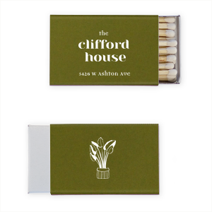 This Our House Plant Matchbox features crisp typography, a printed street address, and a delicate potted-plant illustration. Add a refined, personalized touch to your space with a stylish, functional accent. Paired well with housewarmings or dinner parties.