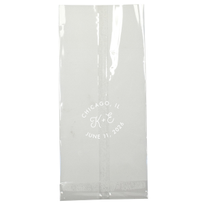 The Bespoke Logo Initials Stamp Wedding Bag design charmingly transforms the couple's initials into a bespoke logo, playfully echoing the sophistication of a stamped seal. Arching the city and date around it adds a personalized flair, turning each piece into a unique hallmark of their special day.