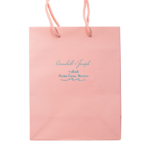 "Embrace the seaside spirit with the Beach Wave Gift Bag featuring a sleek wave design. Personalize with three lines of text to conjure the ocean's rhythm, creating a breezy, bespoke gift experience for your beach-themed celebration.