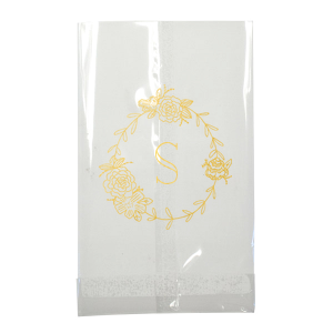 The Romantic Peony Frame Monogram Bag elegantly captures the essence of joy and romance. A wreath of lush peonies and greenery forms a delicate frame, encircling the celebrant's initial in a graceful display. This design exudes elegance, symbolizing happiness, prosperity, and a blissful union.