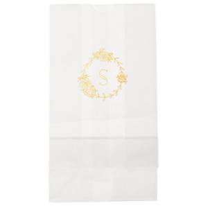 The Romantic Peony Frame Monogram Bag elegantly captures the essence of joy and romance. A wreath of lush peonies and greenery forms a delicate frame, encircling the celebrant's initial in a graceful display. This design exudes elegance, symbolizing happiness, prosperity, and a blissful union.