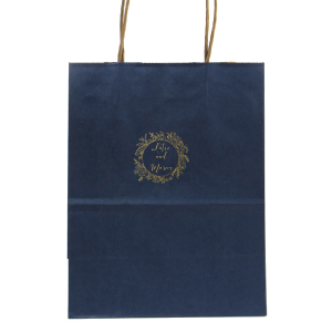 The Regal Wreath Bag design presents an elegant and abundant floral wreath, symbolizing luxury and nature's richness. Enclosed within this lush botanical embrace, the couple's names are elegantly scripted, adding a touch of royal sophistication. This design artfully marries opulence with the charm of natural abundance.