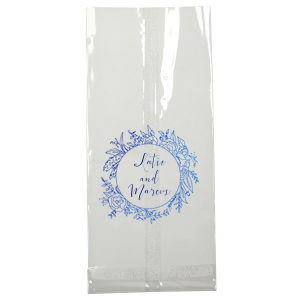 The Regal Wreath Bag design presents an elegant and abundant floral wreath, symbolizing luxury and nature's richness. Enclosed within this lush botanical embrace, the couple's names are elegantly scripted, adding a touch of royal sophistication. This design artfully marries opulence with the charm of natural abundance.