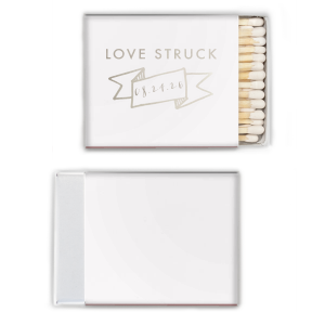 Ignite romance with the Love Struck Banner Matchbox featuring the smitten phrase above a banner cradling your special date. This design charmingly captures the couple's love, making each strike a celebration of their union.