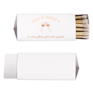 A Nice Place For Nice People Matches features a charming clinking-glasses illustration below the couple’s names and playful script tagline. Add it to your bar cart to elevate gatherings and showcase your welcoming style. Spot-on for dinner parties or casual celebrations at home.