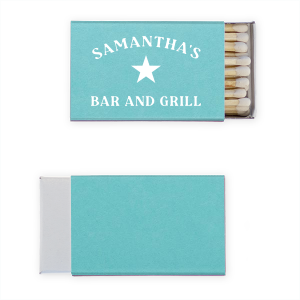 My Place Bar And Grill Matches features bold lettering of your name and “bar and grill” with a classic star emblem for a vintage-inspired look. Customize yours to create a memorable takeaway that guests will appreciate and use. A standout for housewarmings and cookouts!