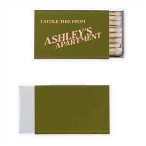 The Minimal Stolen From Their Place Matches features bold slanted typography and a tongue-in-cheek message with a customizable apartment name for playful decor. Grab one to add humor and personality to your hosting essentials. Great for housewarmings or casual get-togethers.