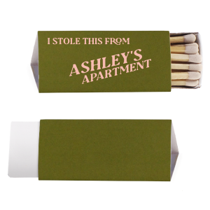 The Minimal Stolen From Their Place Matches features bold slanted typography and a tongue-in-cheek message with a customizable apartment name for playful decor. Grab one to add humor and personality to your hosting essentials. Great for housewarmings or casual get-togethers.