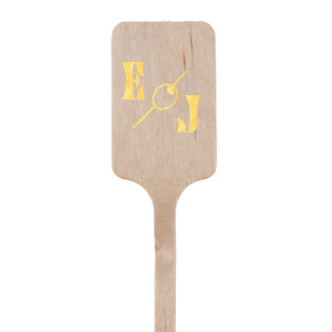 The Martini Olive Stir Stick features a stylish depiction of an olive, the quintessential martini garnish, artfully drawn to evoke the sophistication of a classic cocktail lounge. Flanking this iconic graphic are your initials, rendered in a font that boasts clean lines and an air of modern refinement. This personalized stirrer lends a chic and celebratory twist to your event's drinkware, making it a perfect match for occasions that call for a touch of timeless elegance.