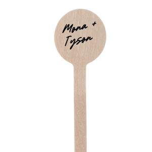 The Lovers' Script Stir Stick offers a touch of whimsy and romance, allowing you to personalize it with your names in a font that is dreamy and full of charm, with sweeping curves and elegant flourishes that capture the feeling of a love story. This personalized stir stick is a beautiful addition to any couple's event, providing a fanciful and intimate detail to your signature beverages.