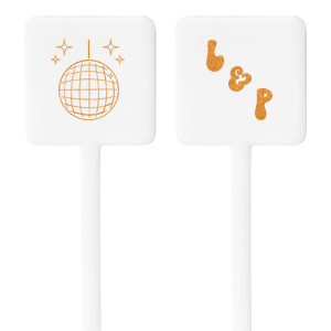 Our Groovy Initials Stir Stick captures the excitement and energy of a night out with a sparkling disco ball graphic on one side, setting the tone for a fun-filled event. On the other side, your initials are showcased in a font that has a retro nod. This personalized stir stick is the perfect addition to any celebration looking to combine romance with the vibrant pulse of the dance floor.