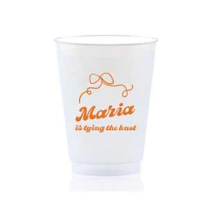 Sip in celebration with the Bow & Bliss Bridal Cup, ideal for a bridal shower or bachelorette party, personalized with the bride-to-be's name and the sweet sentiment "is tying the knot," accented by a romantic and chic bow graphic.