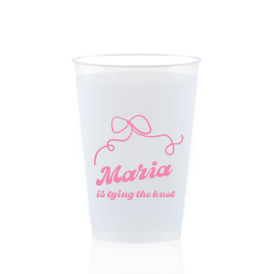 Sip in celebration with the Bow & Bliss Bridal Cup, ideal for a bridal shower or bachelorette party, personalized with the bride-to-be's name and the sweet sentiment "is tying the knot," accented by a romantic and chic bow graphic.