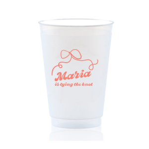 Sip in celebration with the Bow & Bliss Bridal Cup, ideal for a bridal shower or bachelorette party, personalized with the bride-to-be's name and the sweet sentiment "is tying the knot," accented by a romantic and chic bow graphic.
