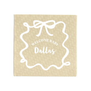 Welcome the newest addition with the Ribbon Frame Welcome Baby Napkin, customizable with the baby's name, and adorned with the affectionate phrase "welcome baby," set within a ribbon-crafted frame and topped with a charming bow graphic. Perfect for stylish and tender baby shower celebrations.