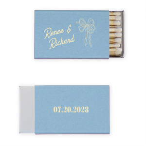 Celebrate your union with the Nuptial Grace Bow Matchbook, personalized with the couple's name in a modern script. The beautifully flowing bow graphic adds an element of elegance and movement, perfect for your sophisticated wedding day.